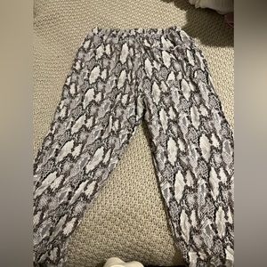 Olivaceous snake skin joggers